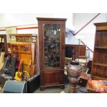 A Georgian mahogany tall corner cupboard with glazed door over cupboard door,