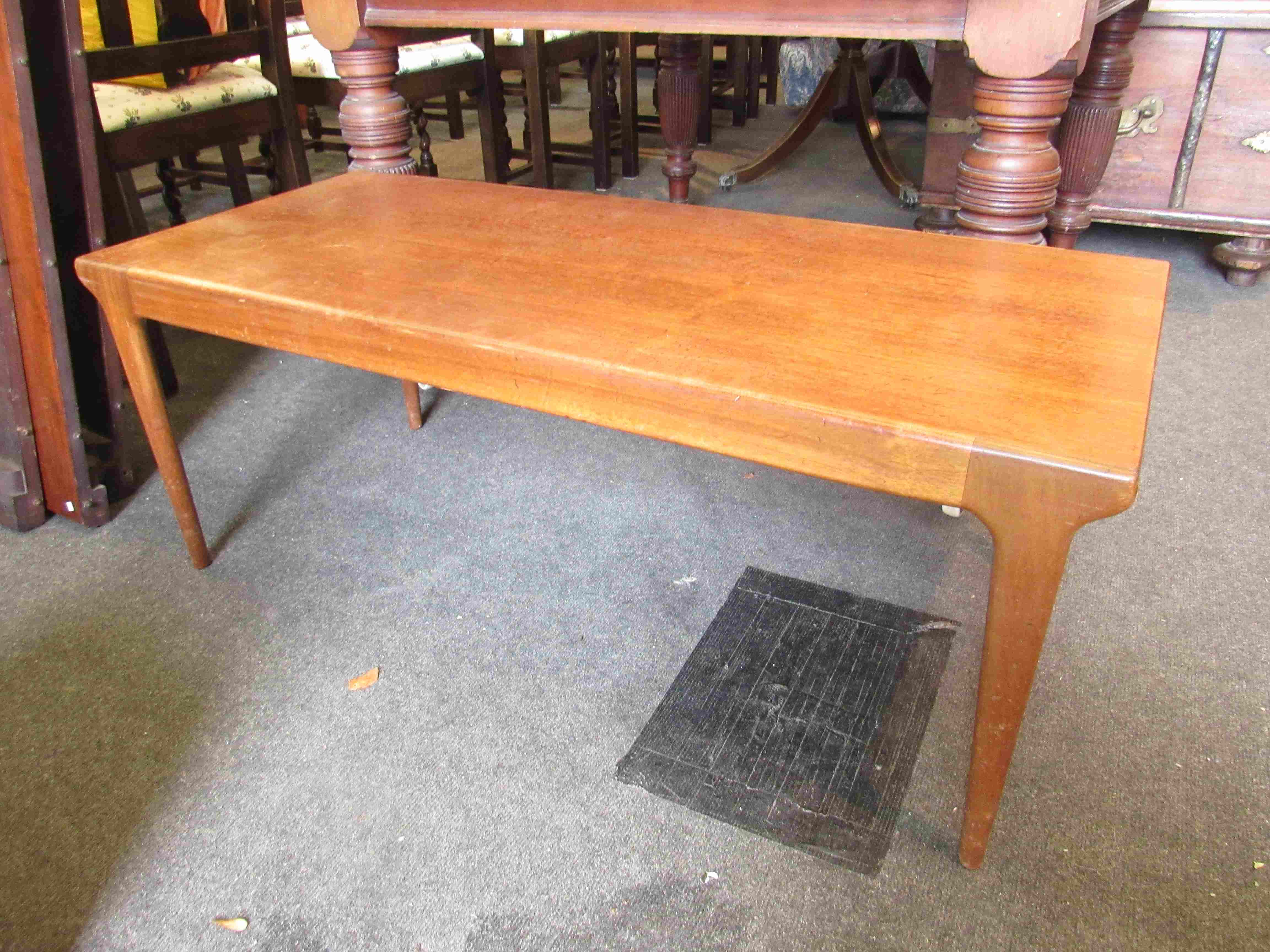 A 1970's teak coffee table,