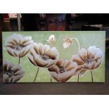 A modern canvas wall hanging embossed with silver coloured flowers,