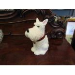 A ceramic biscuit barrel in the form of a Scottish Terrier dog