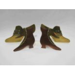 Two pairs of brass mantelpiece shoe ornaments
