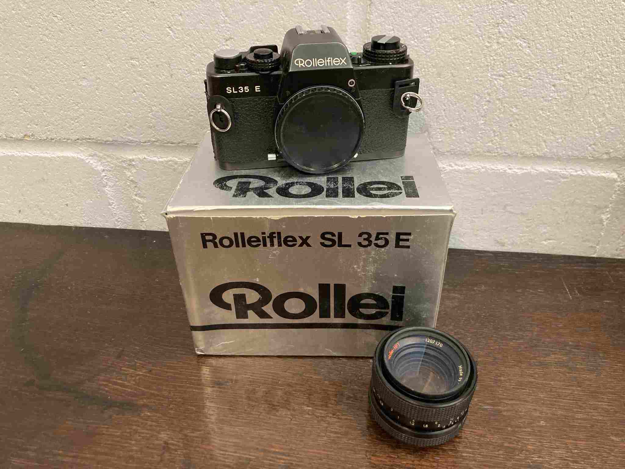 A Rolleiflex SL35E SLR camera with case and 50mm lens