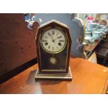 An American mantel clock with Roman dial,