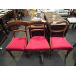 A pair of mahogany bar-back dining chairs and another,