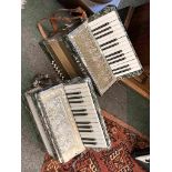 An Alvari 25 key 12 bass accordion and a Bonelli 25 key 12 bass accordion with bracket adaptation