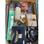 A box of mixed cameras including Olympus OM-1,
