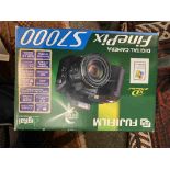 A Fujifilm Finepix S7000 digital camera,