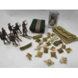 A small selection of military items including buttons epaulettes,