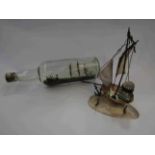 A ship in a bottle and ship form inkwell engraved "Dieppe"