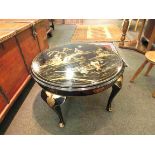 An Oriental lacquered circular coffee table with Oriental scenes on cabriole legs, 61cm diameter,
