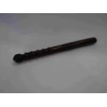 A lignum vitae policeman's truncheon