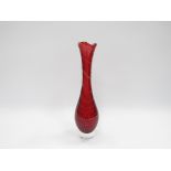 An Italian cranberry glass vase with controlled bubble detail.