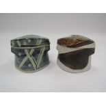 Two studio pottery lidded mould built pots with brushwork detail.