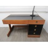 GEORGE SNEED (b.1927) - An oak and ebonsied desk of contemporary style.