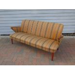 A 1040's Danish three seater sofa, original striped upholstery,