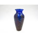 An Okra Glass iridescent vase in blue and red. Unmarked. 16.