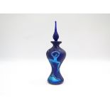 An Okra glass perfume bottle, iridescent blues with dancing figures.