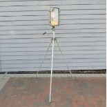 An industrial style lamp on tripod base,