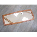 A Danish teak framed wall mirror.