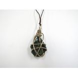 A large 1970s aventurine nugget pendant with spiralised metal mount
