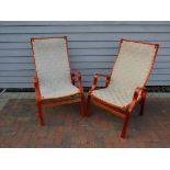 A pair of stained laminated bent ply armchairs in Bruno Mathsson style,