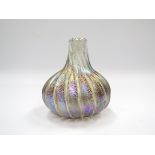 A Ditchfield Glasform studio glass onion vase, speckled iridescent purple and blue.