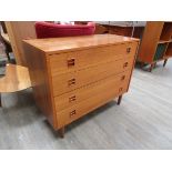 A Danish teak chest of four drawers, raised on tapering legs 87.