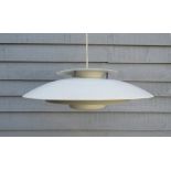 A Danish four tiered ceiling light in the Poulsen style in white,