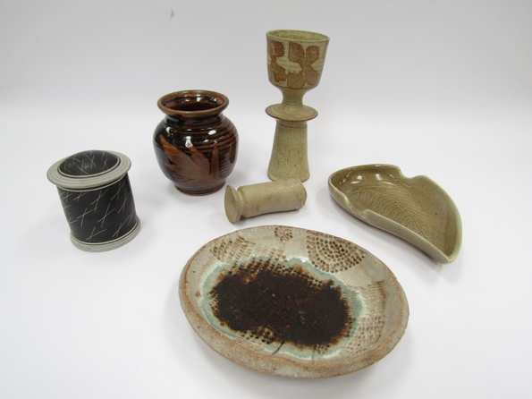 A collection of studio pottery to include early Chris Carter vase with tenmoku and wax resist leaf