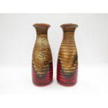 A pair of Scheurich Keramik ribbed vases with red lava, tan and black. No. 293-30.