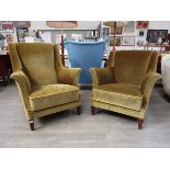A 1940's Danish his & hers armchairs, original green velour upholstery,