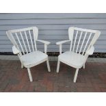 A pair of 1940's 'Canada' white painted armchairs by Fritz Hansen, wing back,