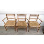 GEORGE SNEED (b.1927) A set of three oak country chairs with woven rush seats.