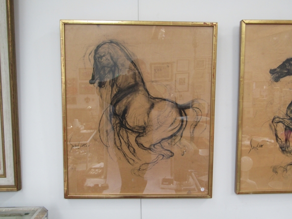 SUNIL DAS (Indian 1939-2015): A framed and glazed charcoal on paper drawings of horses.