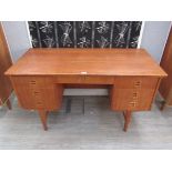 A Danish teak twin pedestal desk with seven drawers, open back,