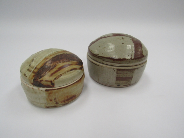 Two studio popttery lidded pots with geometric ash glaze brushwork. Impressed seal to one.