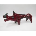 A Roberto Rigon style Italian pottery figure of Rhino with deep red and green glazes.