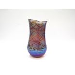 SIDDY LANGLEY (b.1955): A studio glass vase, iridescent blues with line detail.