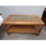 GEORGE SNEED (b.1927) An oak two tier coffee table with tiled inset top.