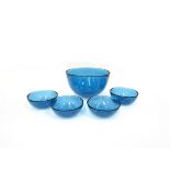 An Orrefors 'Fuga' range fruit bowl and four matching dessert bowls in blue,