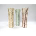 Hornsea Pottery - A collection of three "Water Cooler" form vases in various colour ways,