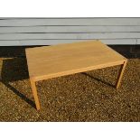 A light oak large coffee table recantangular top,