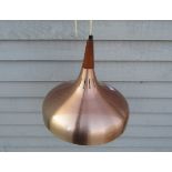 A Danish ceiling pendant in anodised copper and teak.