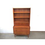 A Danish teak writing bureau with open shelves above tambour front, fitted interior.