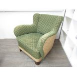 A 1940's Danish small armchair with original green geometric upholstery,