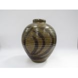 A studio pottery stoneware vase with ribbed body, painted line detail and dark olive green glaze,