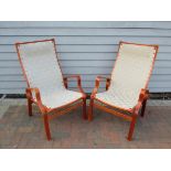 A pair of stained laminated bent ply armchairs in Bruno Mathsson style,