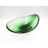 A Scandinavian green glass free form bowl.