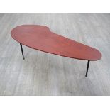 A 1950's teak occasional table with stretched palette shaped top,