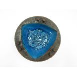 An Italian Pottery dish with blue glazed interior decorated with impressed foliate detail.